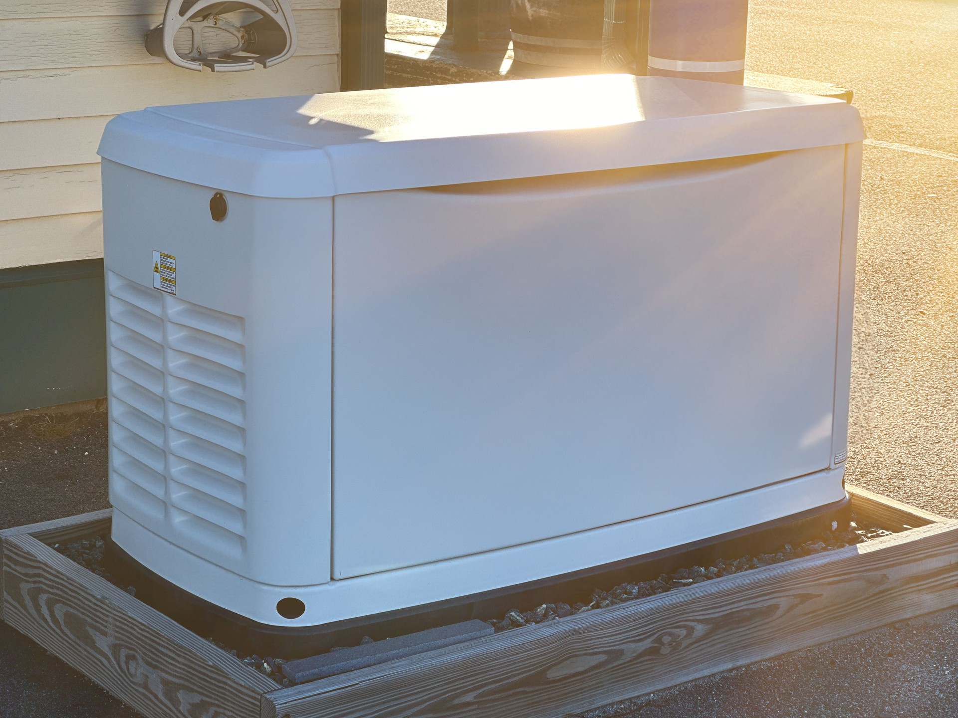 A Home Standby Generator installed at the backyard of a house