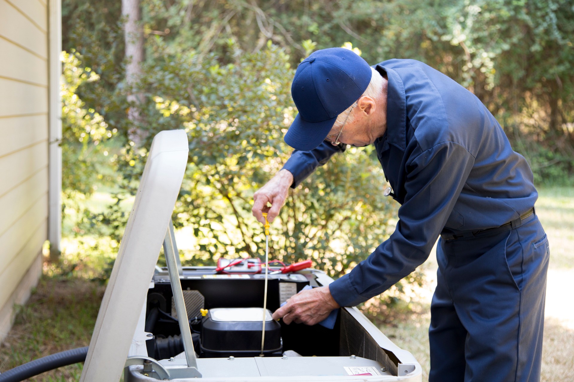 Technician services outside AC units and generator.