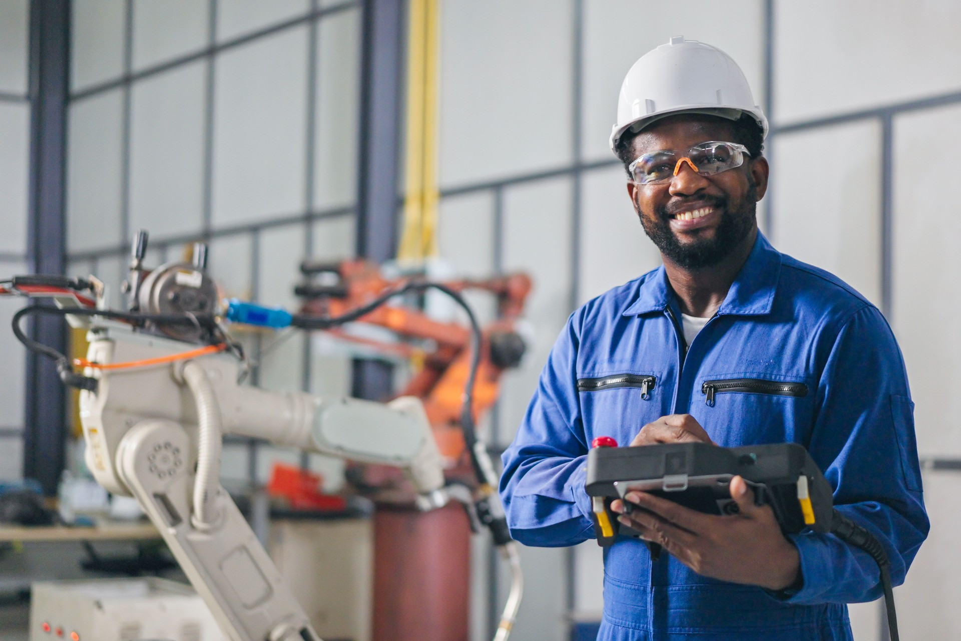 Professional Engineer African-American smiles and looking at camera